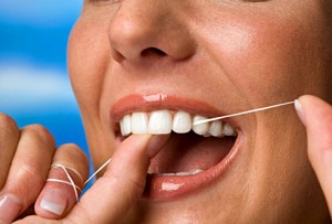 Woman Flossing